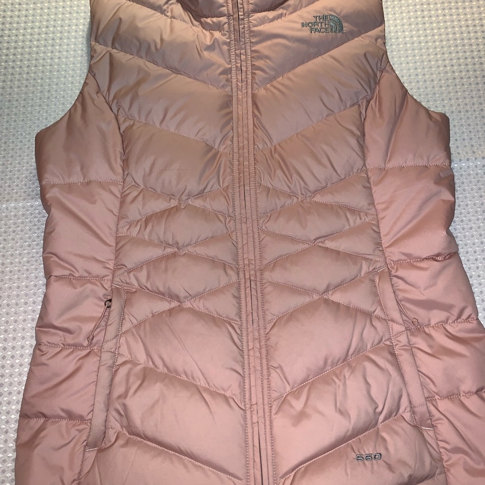 Womens North Face pink vest. Fitted.